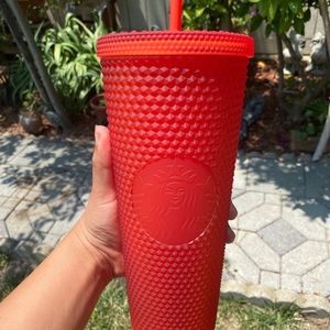Red studded Starbucks cup